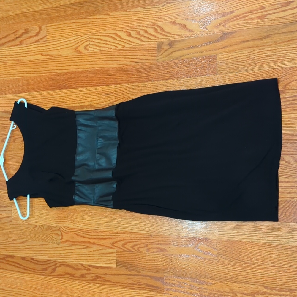 Soft cotton sleeveless little black dress leather band around the center.  small